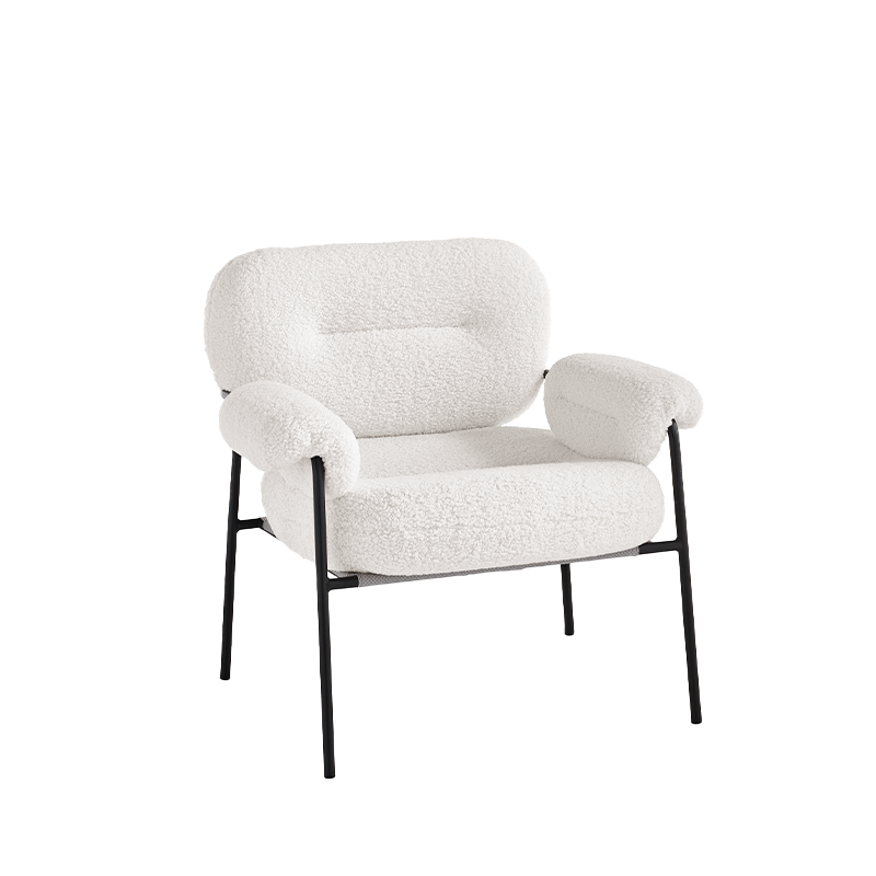 Poltrona in tessuto bouclè con struttura in metallo.